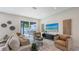 Bright living room with sliding glass doors, a seamless indoor-outdoor transition and neutral color palette at 2590 Floyd St, Sarasota, FL 34239
