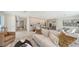 Open-concept living area with modern finishes, a comfortable sofa, and seamless flow to the kitchen at 2590 Floyd St, Sarasota, FL 34239