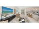 Open-concept living room with neutral decor, modern furnishings, and seamless access to other areas of the home at 2590 Floyd St, Sarasota, FL 34239