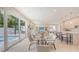 Bright living space with a dining area, modern kitchen, and an outdoor view with a pool at 2590 Floyd St, Sarasota, FL 34239