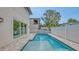 Backyard featuring a modern pool and spa with brick paver surround at 2590 Floyd St, Sarasota, FL 34239