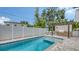 Backyard pool with outdoor kitchen and privacy fence providing a relaxing and private outdoor retreat at 2590 Floyd St, Sarasota, FL 34239