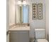 Elegant powder room featuring a modern vanity, stylish mirror, and contemporary decor at 2590 Floyd St, Sarasota, FL 34239