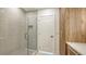 Contemporary bathroom with a glass shower and stylish tile, and an adjacent wooden cabinet at 2590 Floyd St, Sarasota, FL 34239