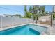 Beautiful backyard swimming pool with patio and outdoor kitchen at 2590 Floyd St, Sarasota, FL 34239
