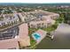 Aerial of complex, showcasing private pool, serene lakefront, and lush landscaping at 3635 Lake Bayshore Dr # J-410, Bradenton, FL 34205