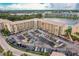 Aerial view of the building with assigned parking spots and lakeside location at 3635 Lake Bayshore Dr # J-410, Bradenton, FL 34205