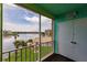 Relaxing balcony view overlooking lush landscapes and a serene lake, offering a tranquil outdoor space at 3635 Lake Bayshore Dr # J-410, Bradenton, FL 34205