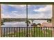 Relaxing balcony view of the lake, building and blue skies at 3635 Lake Bayshore Dr # J-410, Bradenton, FL 34205
