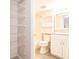 This bathroom features a shower, toilet, vanity, and shelving at 3635 Lake Bayshore Dr # J-410, Bradenton, FL 34205