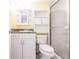 Bathroom with a white vanity, toilet, and a glass-enclosed shower with tile surround at 3635 Lake Bayshore Dr # J-410, Bradenton, FL 34205