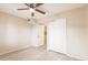 This bedroom features hardwood floors, a ceiling fan, and closet at 3635 Lake Bayshore Dr # J-410, Bradenton, FL 34205