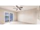 Bedroom with a ceiling fan and sliding doors to a balcony overlooking a lake at 3635 Lake Bayshore Dr # J-410, Bradenton, FL 34205