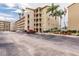Spacious condominium building with lush landscaping and palm trees. Offers covered parking and scenic views at 3635 Lake Bayshore Dr # J-410, Bradenton, FL 34205