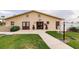 Well-maintained clubhouse exterior with clean walkways and inviting entry for resident use at 3635 Lake Bayshore Dr # J-410, Bradenton, FL 34205