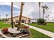 Picturesque clubhouse exterior with manicured lawns and colorful flower beds, perfect for community gatherings at 3635 Lake Bayshore Dr # J-410, Bradenton, FL 34205