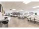 Spacious community room with ample seating, bookshelves, and natural light for resident enjoyment at 3635 Lake Bayshore Dr # J-410, Bradenton, FL 34205