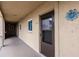 Exterior walkway features neutral colors and leads to unit 410 at 3635 Lake Bayshore Dr # J-410, Bradenton, FL 34205