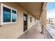 Condominium hallway featuring unit 410 with a neutral color scheme and a view of the parking lot at 3635 Lake Bayshore Dr # J-410, Bradenton, FL 34205