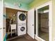Convenient laundry area featuring a stacked washer and dryer and sink for added functionality and ease at 3635 Lake Bayshore Dr # J-410, Bradenton, FL 34205