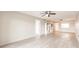 A spacious living room is enhanced by luxury vinyl plank flooring and a neutral color scheme at 3635 Lake Bayshore Dr # J-410, Bradenton, FL 34205