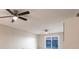 The living room features luxury vinyl plank flooring, a ceiling fan, and a water view at 3635 Lake Bayshore Dr # J-410, Bradenton, FL 34205