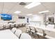 Large meeting room with tables and chairs, providing a functional space for community events and activities at 3635 Lake Bayshore Dr # J-410, Bradenton, FL 34205
