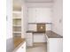 Office space featuring wooden countertops, white cabinets, and shelving at 3635 Lake Bayshore Dr # J-410, Bradenton, FL 34205