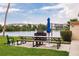 The picnic area includes a charcoal grill, picnic table with seating, and scenic lake views at 3635 Lake Bayshore Dr # J-410, Bradenton, FL 34205