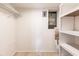 A storage space with white walls, shelves, and an electrical panel at 3635 Lake Bayshore Dr # J-410, Bradenton, FL 34205