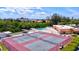 An aerial view of a tennis court, bocce ball court and community pool at 3850 Catalina Dr, Bradenton, FL 34210