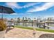 Waterfront backyard featuring a boat dock and patio seating at 3850 Catalina Dr, Bradenton, FL 34210