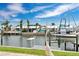 Waterfront backyard featuring a boat dock and lush vegetation at 3850 Catalina Dr, Bradenton, FL 34210