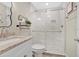 Bright bathroom featuring granite countertops and a glass-door shower at 3850 Catalina Dr, Bradenton, FL 34210