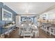 Elegant dining room with a white table set and bright blue accent wall at 3850 Catalina Dr, Bradenton, FL 34210