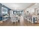 Open dining area with white table and chairs adjacent to the kitchen with views of the water at 3850 Catalina Dr, Bradenton, FL 34210
