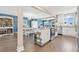 Open concept living with updated kitchen, white cabinets, stainless appliances, and eat-in space at 3850 Catalina Dr, Bradenton, FL 34210