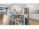 Bright kitchen featuring white cabinets, stainless appliances, and a counter with barstool seating at 3850 Catalina Dr, Bradenton, FL 34210