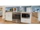 Modern kitchen island featuring stainless steel appliances and granite countertops at 3850 Catalina Dr, Bradenton, FL 34210