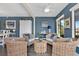 Living area showcasing wicker chairs, stylish decor, and serene atmosphere at 3850 Catalina Dr, Bradenton, FL 34210