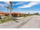 Street view of a quaint neighborhood with well-maintained lawns and matching orange roofs at 3850 Catalina Dr, Bradenton, FL 34210
