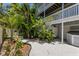 Lush backyard area with tropical foliage and a tranquil atmosphere at 401 N Bay Blvd, Anna Maria, FL 34216