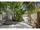 Charming backyard with tropical landscaping, and outdoor space at 401 N Bay Blvd, Anna Maria, FL 34216