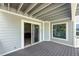 Outdoor balcony with gray decking and access to the interior living space at 401 N Bay Blvd, Anna Maria, FL 34216