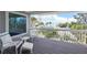 Outdoor deck features seating and views of the Gulf at 401 N Bay Blvd, Anna Maria, FL 34216