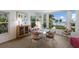 Dining room with an abundance of natural light and tranquil beach views at 401 N Bay Blvd, Anna Maria, FL 34216
