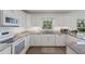 Bright kitchen features granite counters, stainless appliances, and white cabinetry at 401 N Bay Blvd, Anna Maria, FL 34216