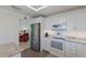 Updated kitchen features stainless steel appliances and ample storage at 401 N Bay Blvd, Anna Maria, FL 34216