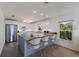 Full kitchen with an eat-in island, stainless appliances, and white cabinetry at 401 N Bay Blvd, Anna Maria, FL 34216