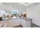 Open kitchen offers granite countertops and views of the living area at 401 N Bay Blvd, Anna Maria, FL 34216
